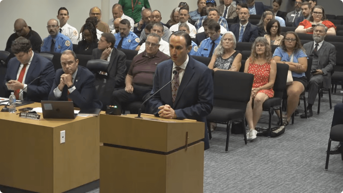 The camera-contract discussion during the August 25, 2026 morning meeting. Frame from the official Pasco County Government recording at 1:21:20.